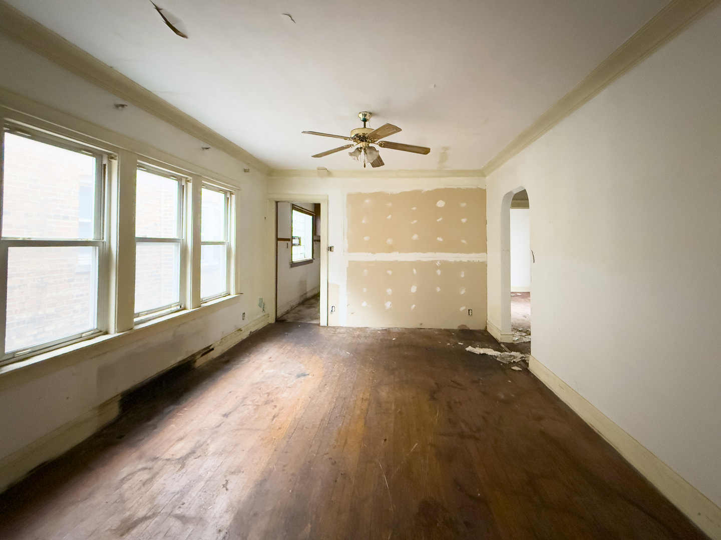 609 East 88th Place Chicago, IL 60619 - Photo 10 of 27 wooden floor in an empty room with a window