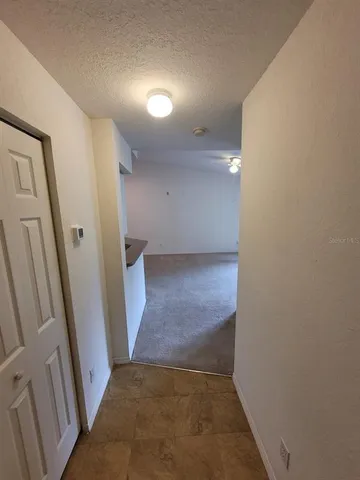 wooden floor in a hall with an entryway