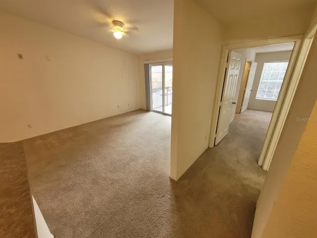 a view of a hallway with windows