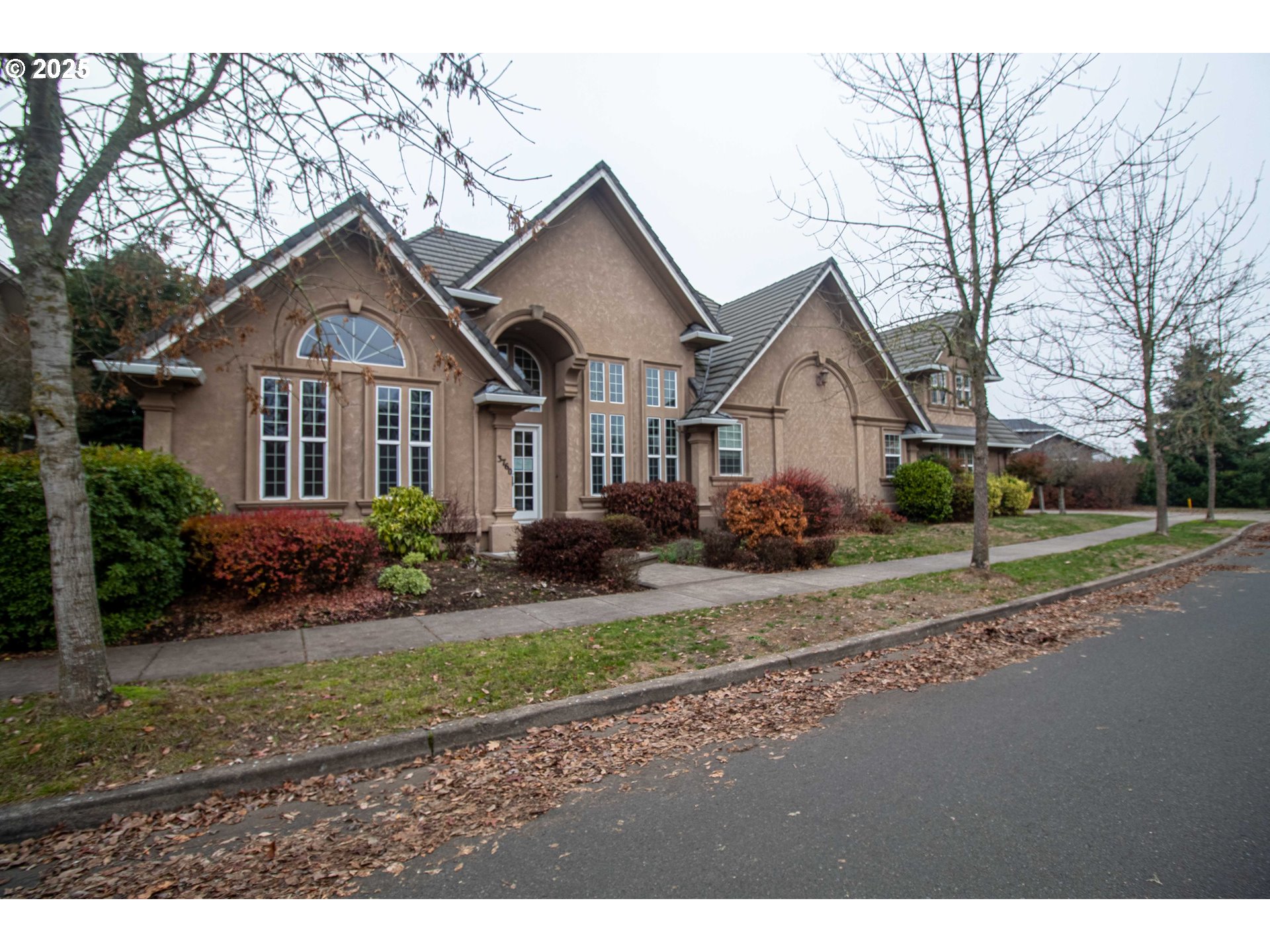 3760 Meadow View Drive Eugene, OR 97408 - Photo 2 of 46 a front view of a house with a yard and garage
