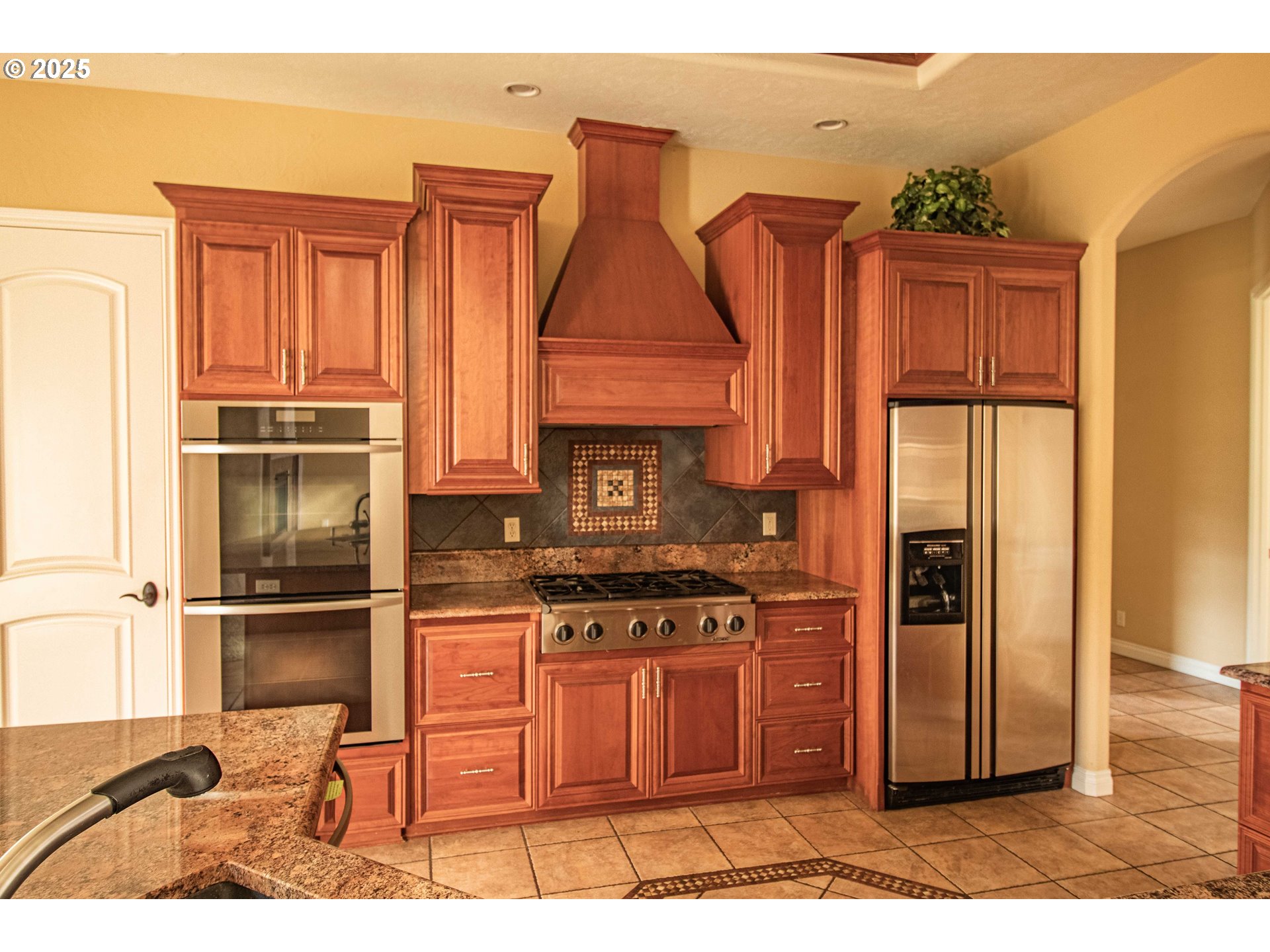 3760 Meadow View Drive Eugene, OR 97408 - Photo 21 of 46 a kitchen with stainless steel appliances granite countertop a refrigerator and a stove