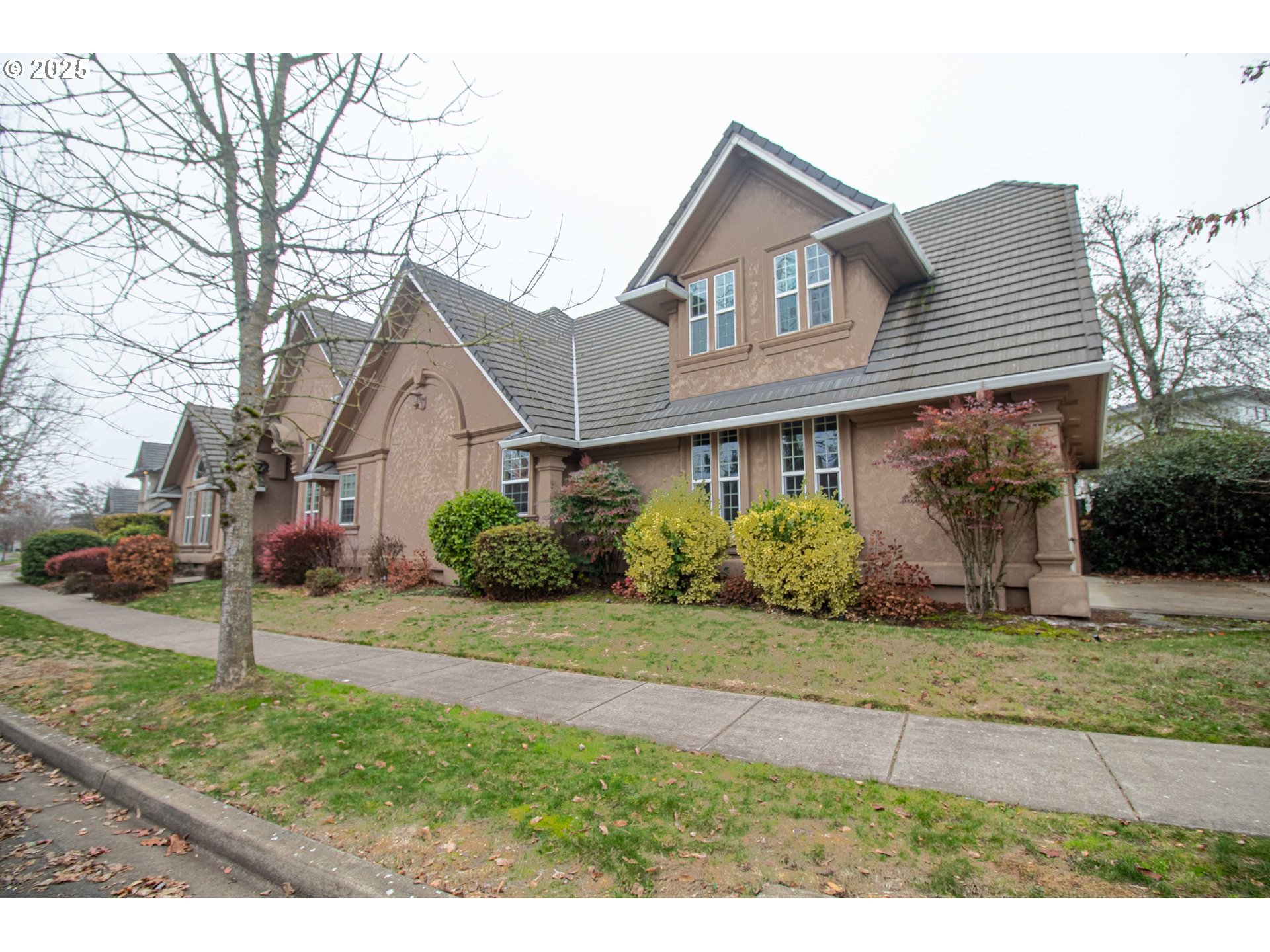 3760 Meadow View Drive Eugene, OR 97408 - Photo 3 of 46 a front view of a house with a yard