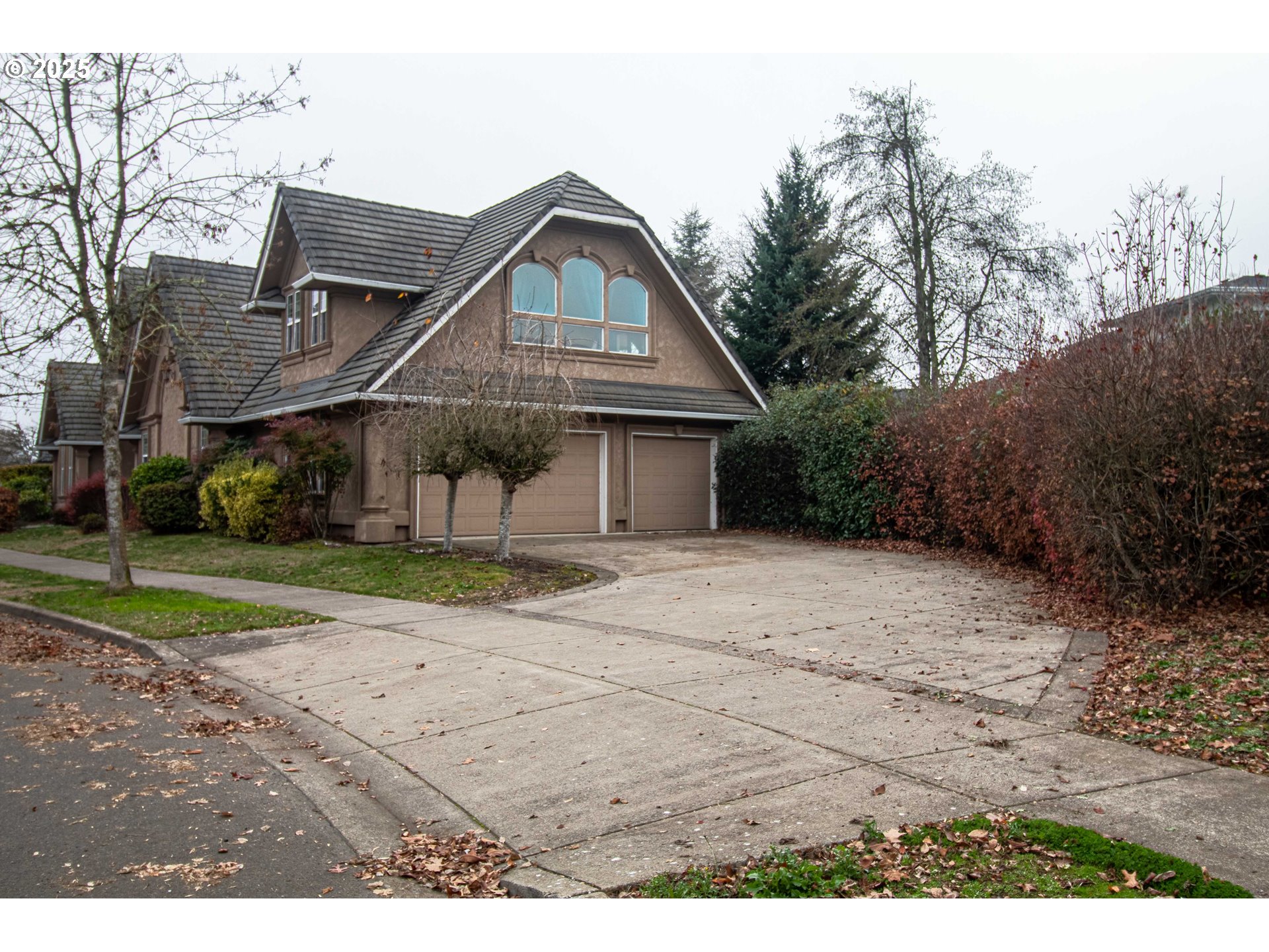 3760 Meadow View Drive Eugene, OR 97408 - Photo 5 of 46 a front view of a house with a yard and garage
