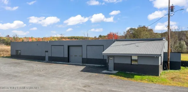 a front view of a house with a garage