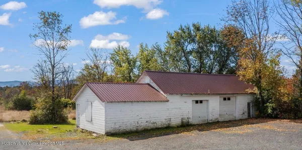a house with trees in the background