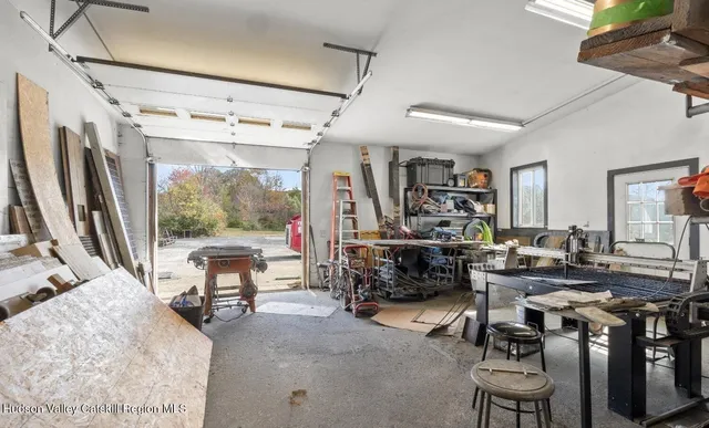 a view of a livingroom with furniture and a window