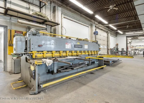 a view of a swimming pool with an outdoor seating