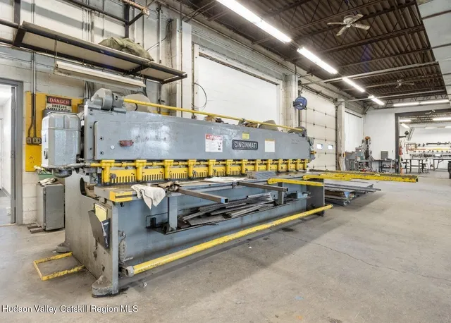 a view of a swimming pool with an outdoor seating