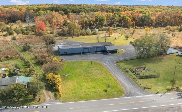 a view of swimming pool with a table and chairs