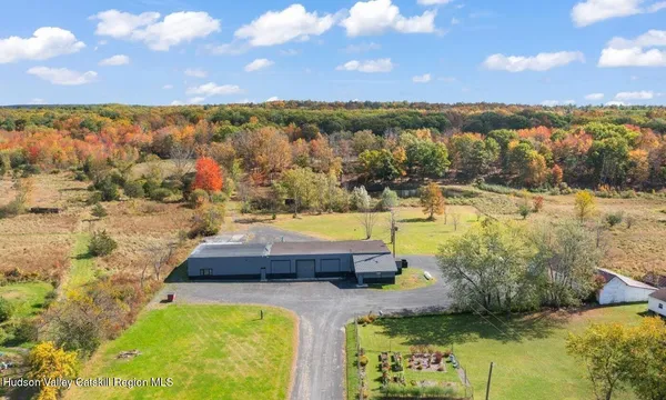 a view of a swimming pool with an outdoor seating