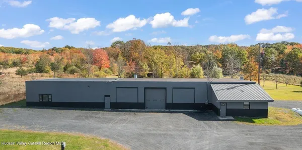 a view of a swimming pool with a lounge chair