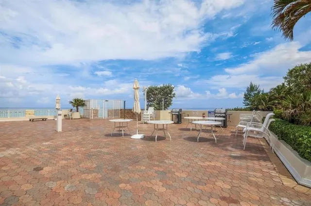 a view of a terrace with furniture