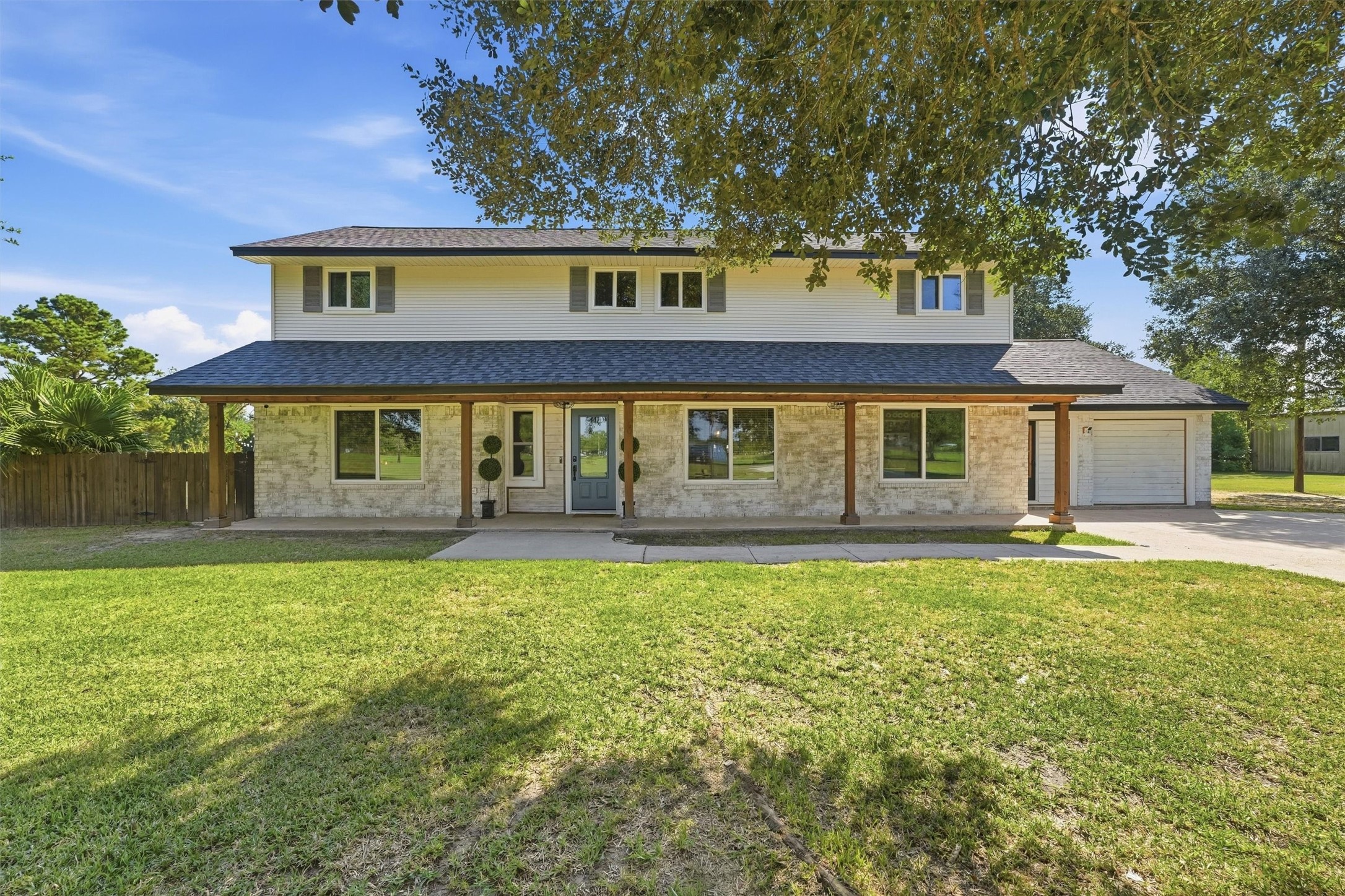 3814 Poskey Road Anahuac, TX 77514 - Photo 7 of 38 Fresh paint and columns on the front exterior