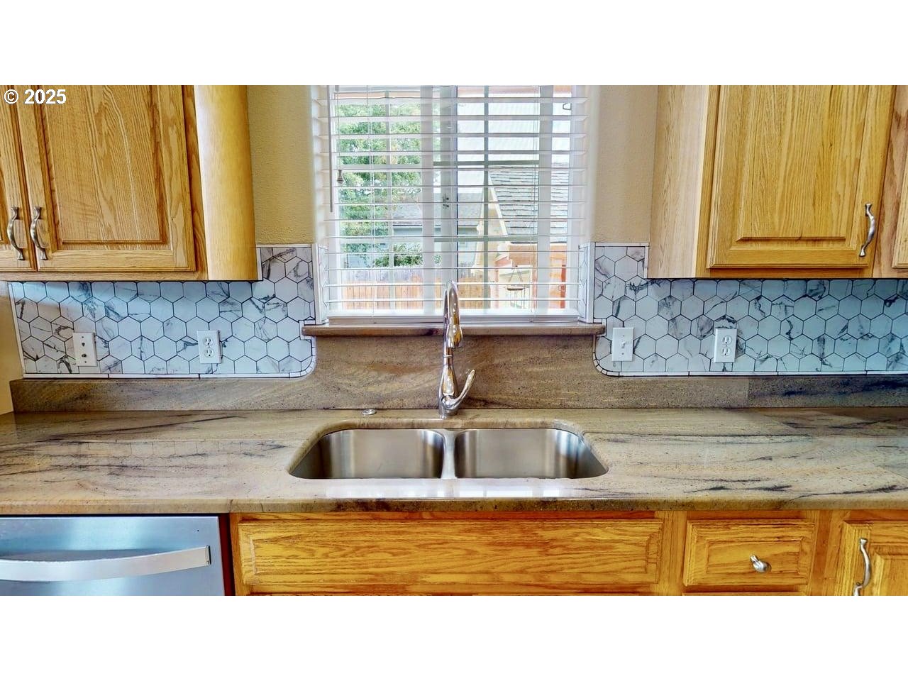 869 North Collier Street Coquille, OR 97423 - Photo 15 of 41 a kitchen with stainless steel appliances granite countertop a sink and a wooden cabinets