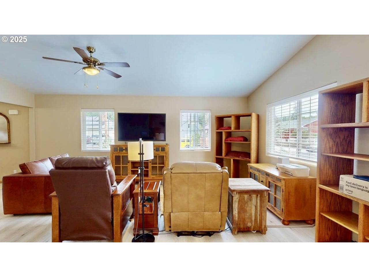 869 North Collier Street Coquille, OR 97423 - Photo 17 of 41 a living room with furniture a flat screen tv and a window