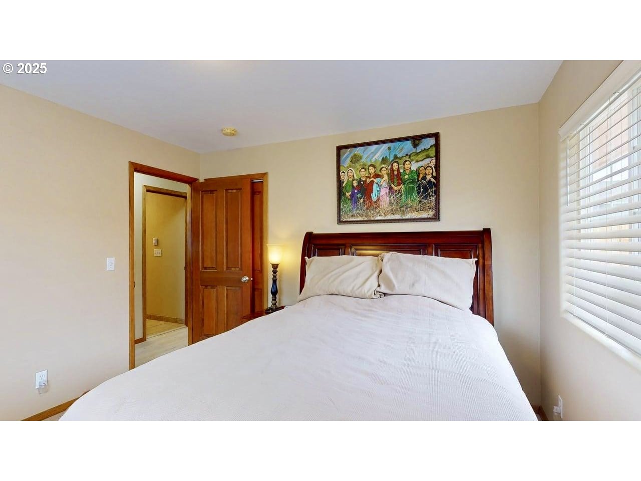 869 North Collier Street Coquille, OR 97423 - Photo 20 of 41 a bedroom with a bed and a painting on the wall