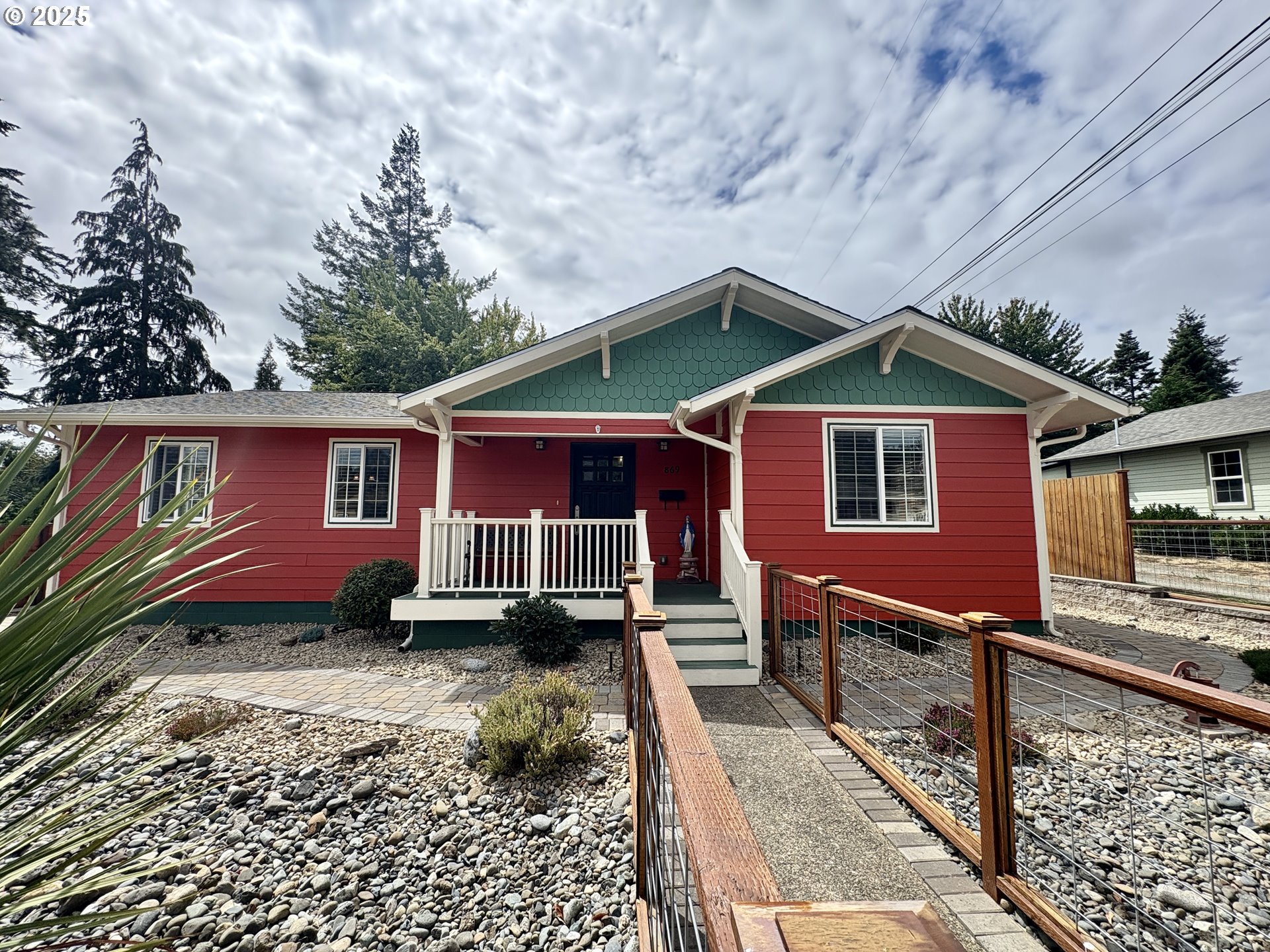 869 North Collier Street Coquille, OR 97423 - Photo 3 of 41 a front view of a house with a yard table and chairs