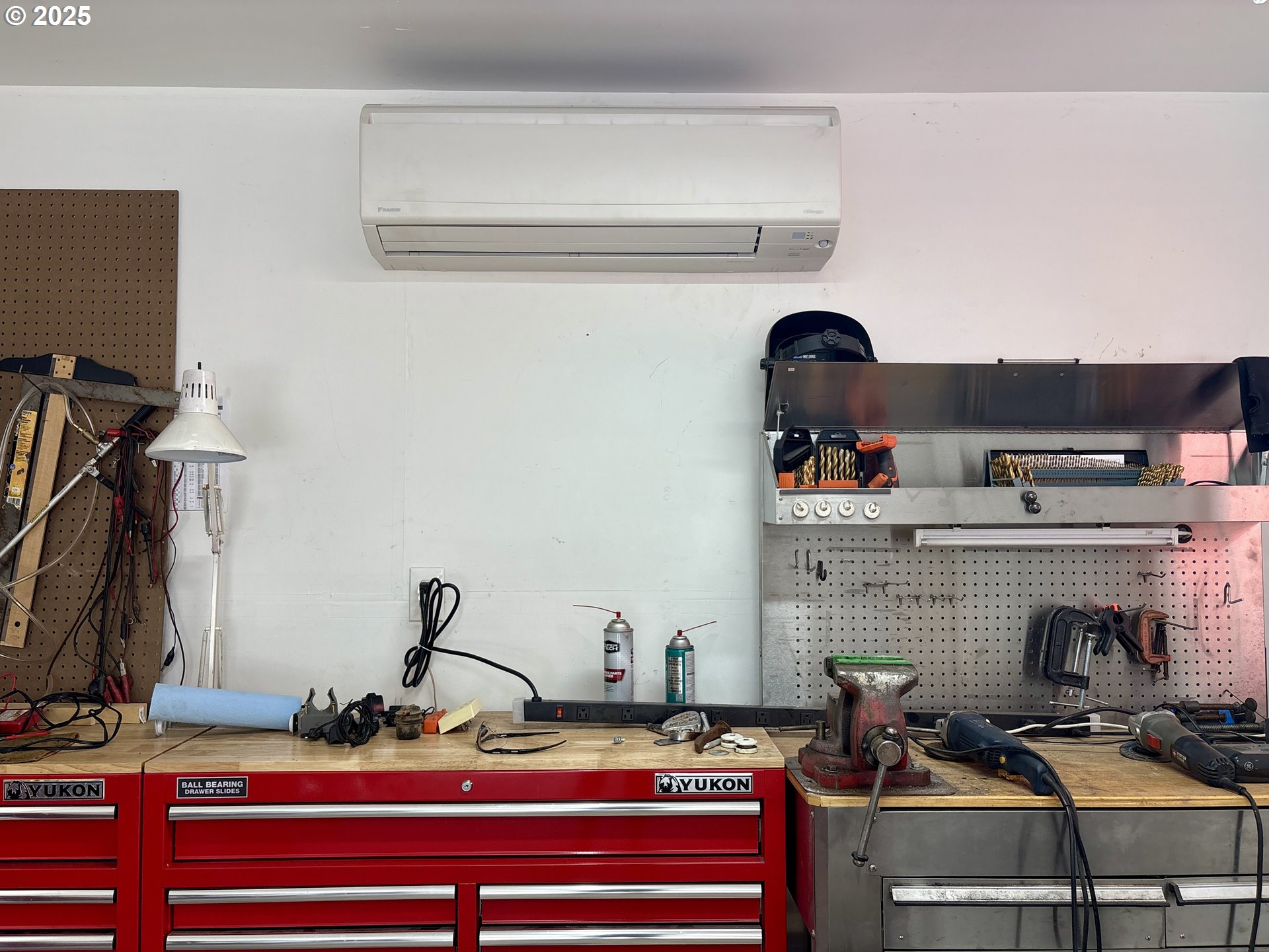 869 North Collier Street Coquille, OR 97423 - Photo 38 of 41 a room with a fireplace and cabinets