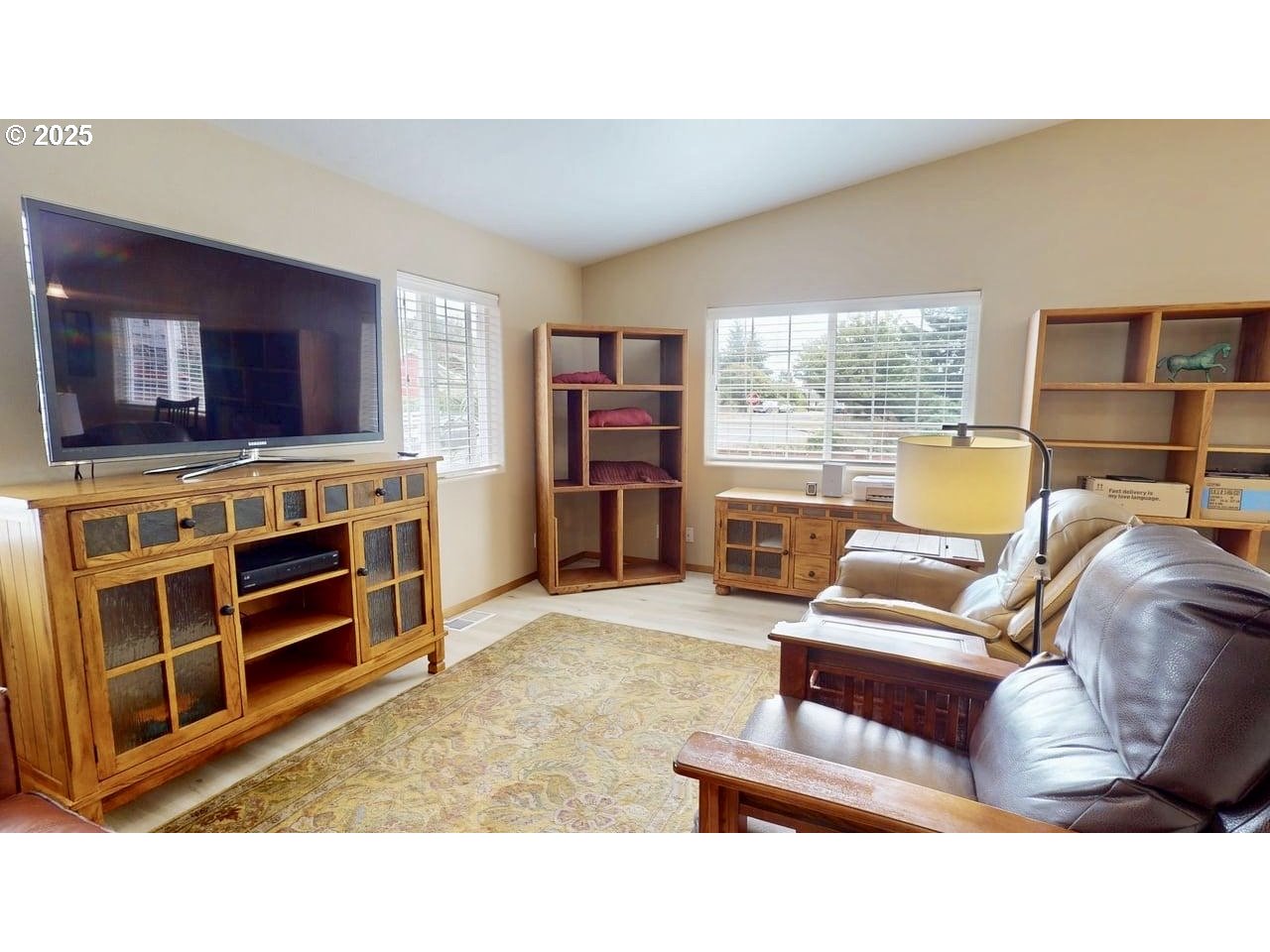 869 North Collier Street Coquille, OR 97423 - Photo 8 of 41 a living room with furniture and a flat screen tv