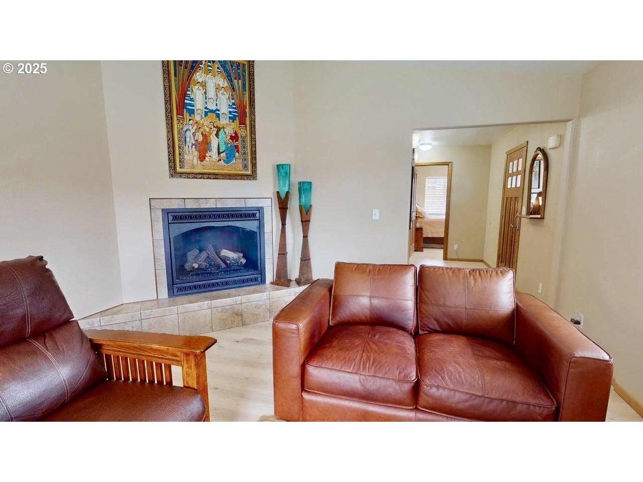 869 North Collier Street Coquille, OR 97423 - Photo 10 of 41 a living room with furniture and a fireplace