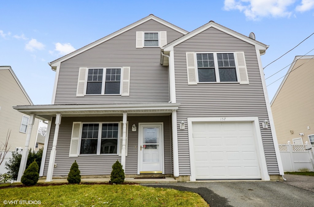 157 Oman Street Fall River, MA 02721 - Photo 1 of 19 a front view of a house with a yard