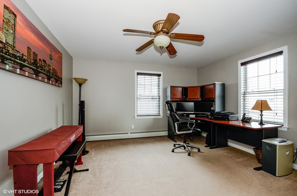 157 Oman Street Fall River, MA 02721 - Photo 13 of 19 a view of a workspace with furniture and a window