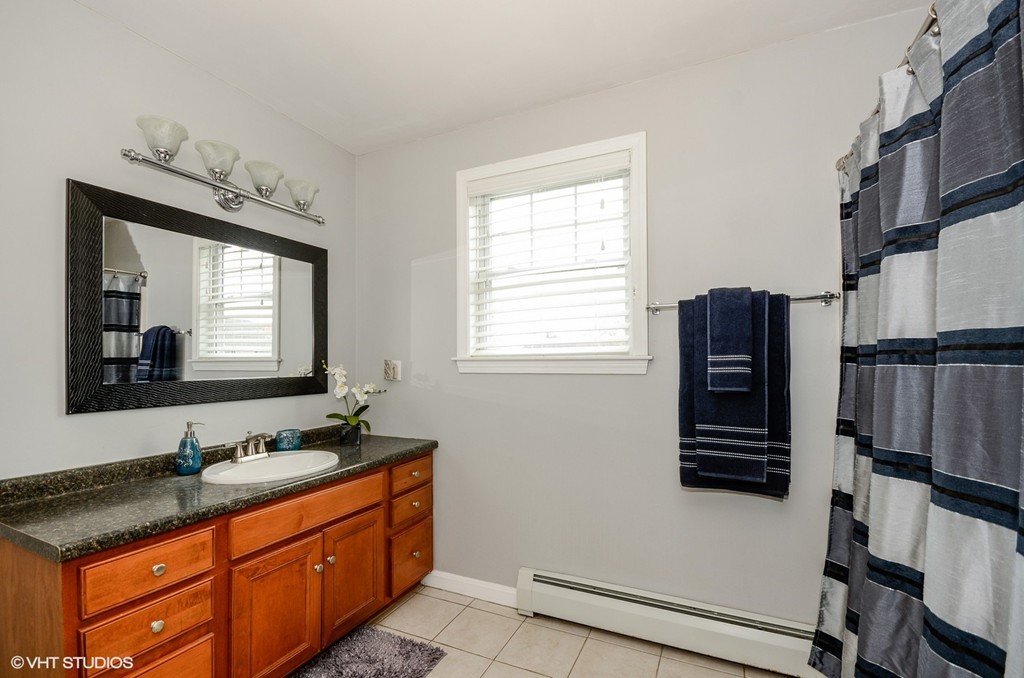 157 Oman Street Fall River, MA 02721 - Photo 14 of 19 a bathroom with a sink double vanity and a mirror