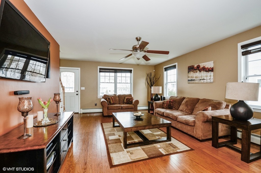 157 Oman Street Fall River, MA 02721 - Photo 5 of 19 a living room with furniture a flat screen tv and a window
