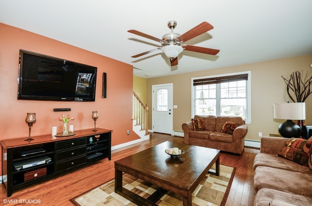 157 Oman Street Fall River, MA 02721 - Photo 6 of 19 a living room with furniture and a flat screen tv