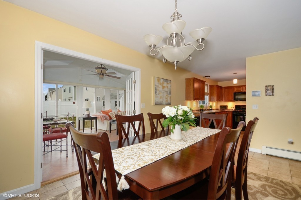 157 Oman Street Fall River, MA 02721 - Photo 8 of 19 a view of a dining room with furniture and a chandelier