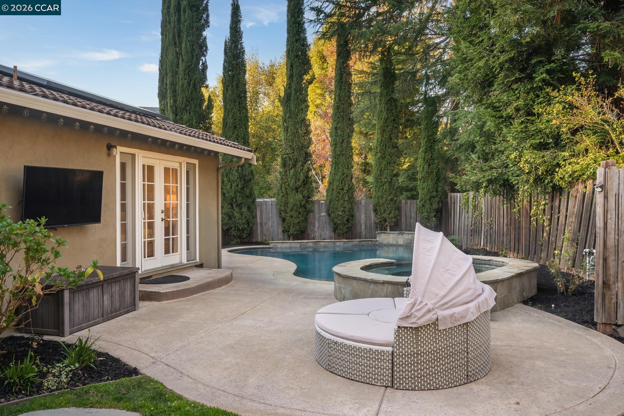 34 Pony Court San Ramon, CA 94583 - Photo 28 of 34 a view of a patio with couches and a fire pit and wooden fence