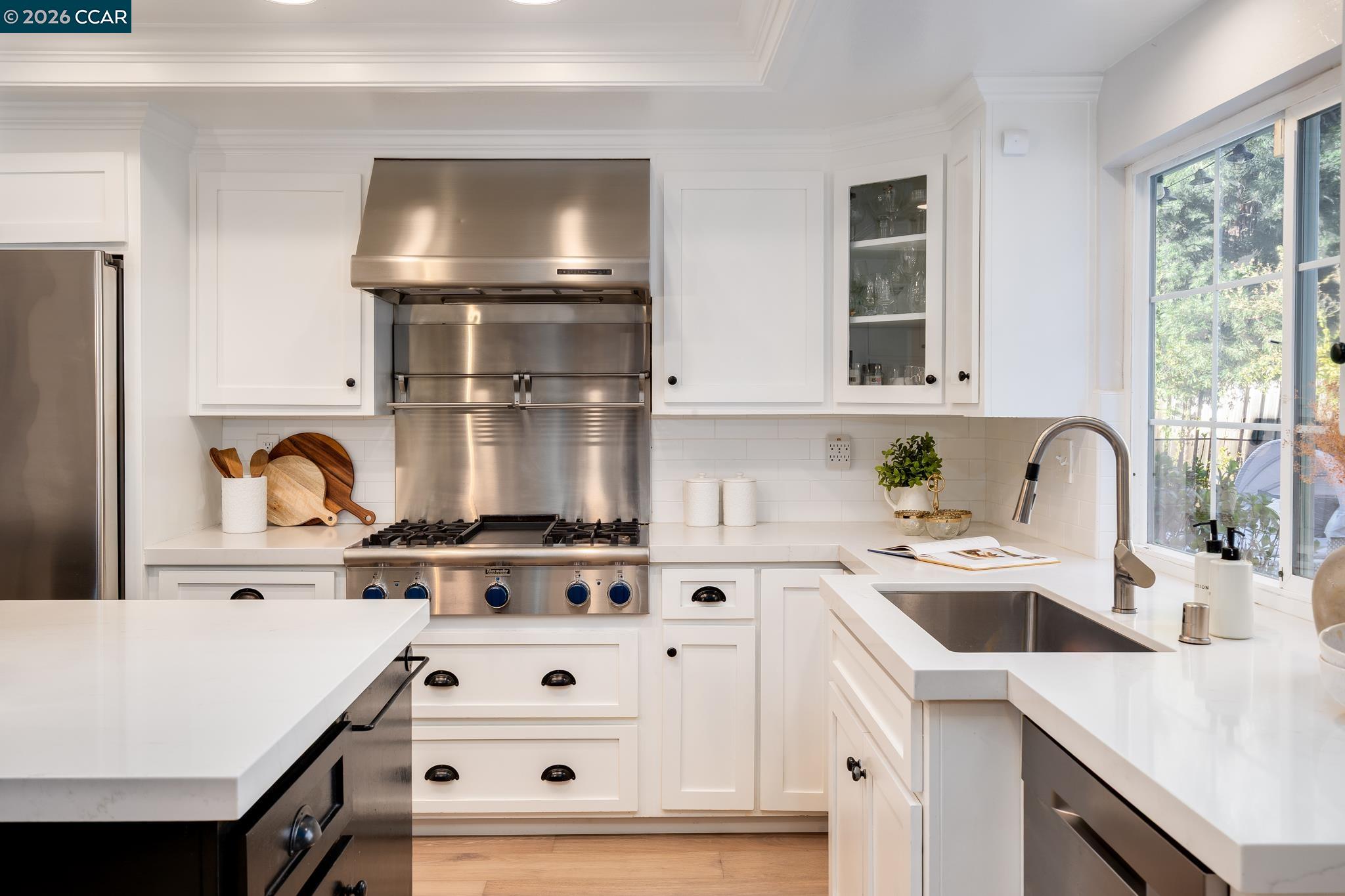 34 Pony Court San Ramon, CA 94583 - Photo 10 of 34 a kitchen with a stove a sink and a microwave