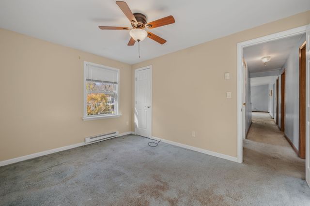 an empty room with a view of a bathroom