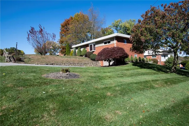 a backyard of a house with lots of green space