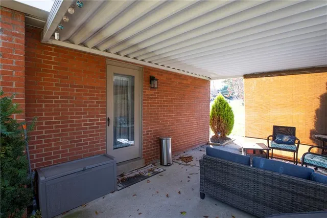 a living room with patio furniture