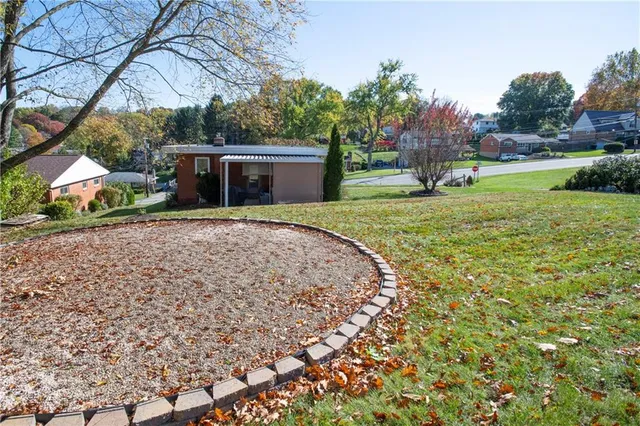 a view of a garden with sitting area
