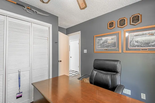 a bedroom with furniture and a window