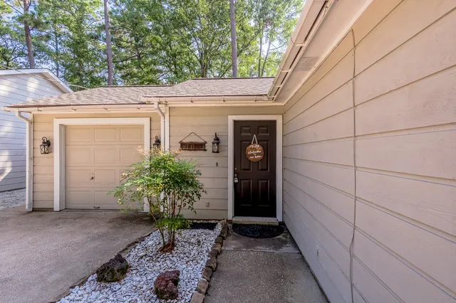 a view of a house with a potted plant
