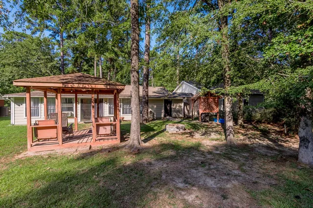 a view of a house with a yard porch and sitting area