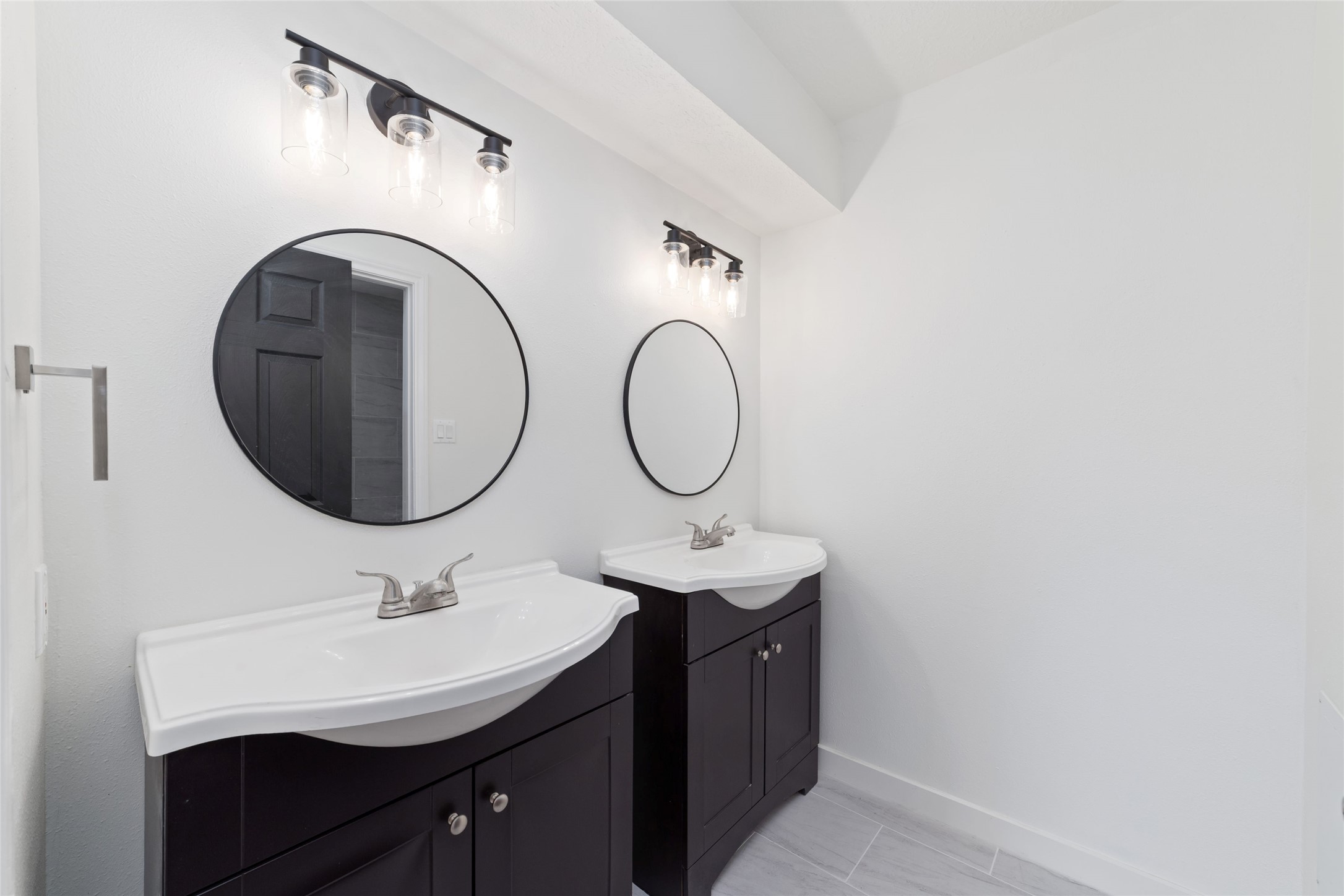 7910 Oak Moss Drive Spring, TX 77379 - Photo 23 of 38 A secondary bathroom on the second floor with a double sink.