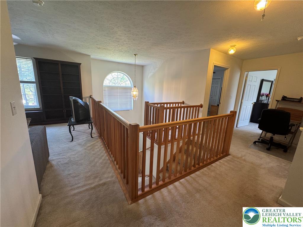 2742 Long Pond Road Long Pond, PA 18334 - Photo 29 of 57 A versatile loft space offers a sun-drenched reading nook and easy access to additional rooms.