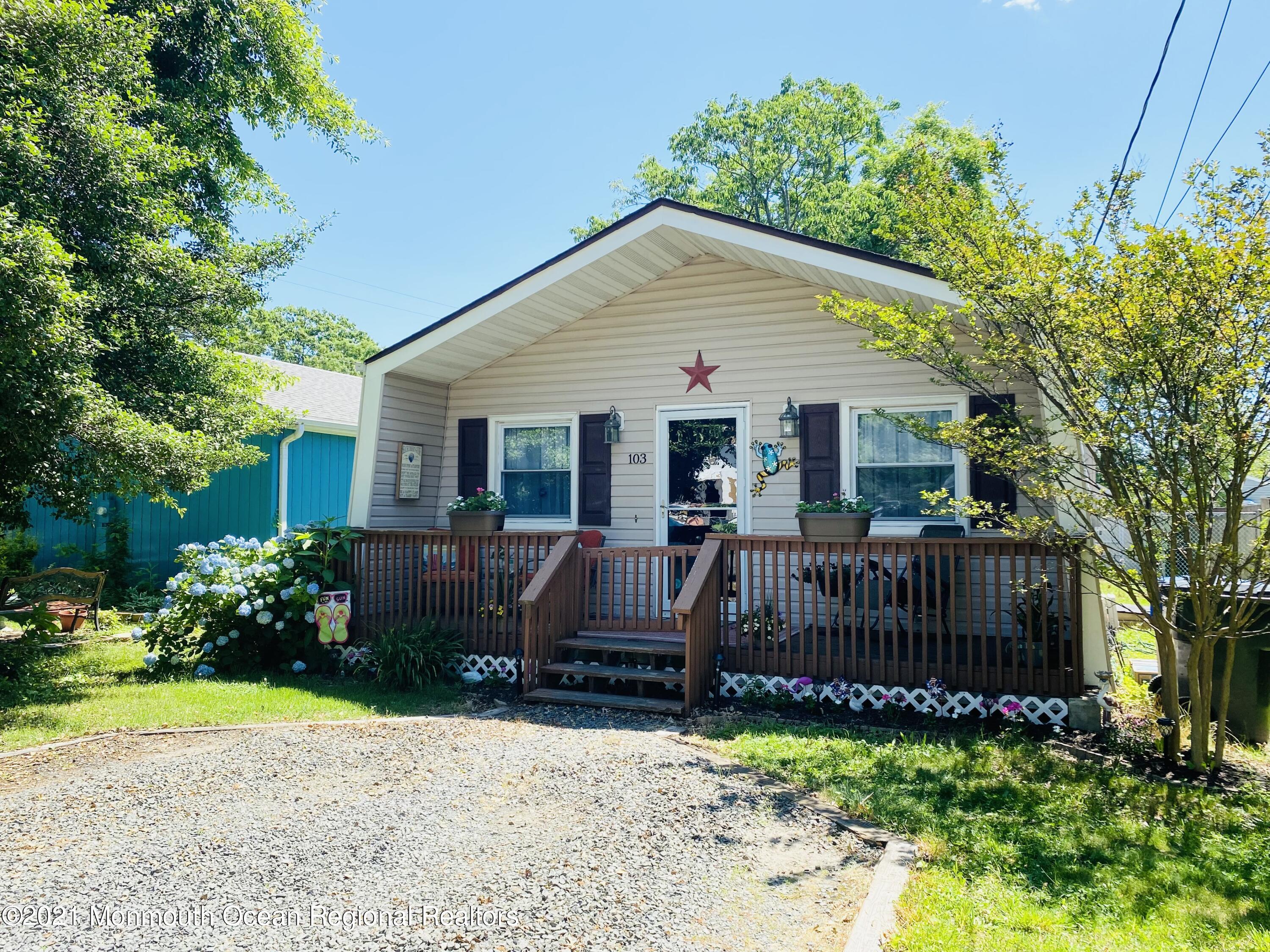 103 George Road Toms River, NJ 08753 - Photo 1 of 34 a view of a house with wooden fence next to a yard