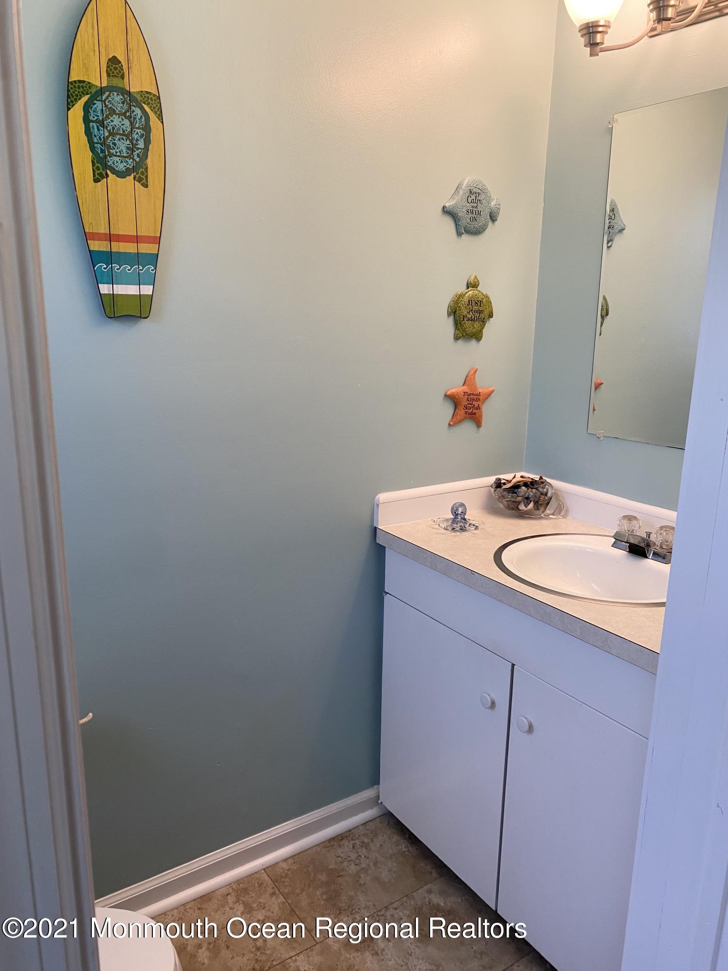 103 George Road Toms River, NJ 08753 - Photo 17 of 34 a bathroom with a sink and a mirror
