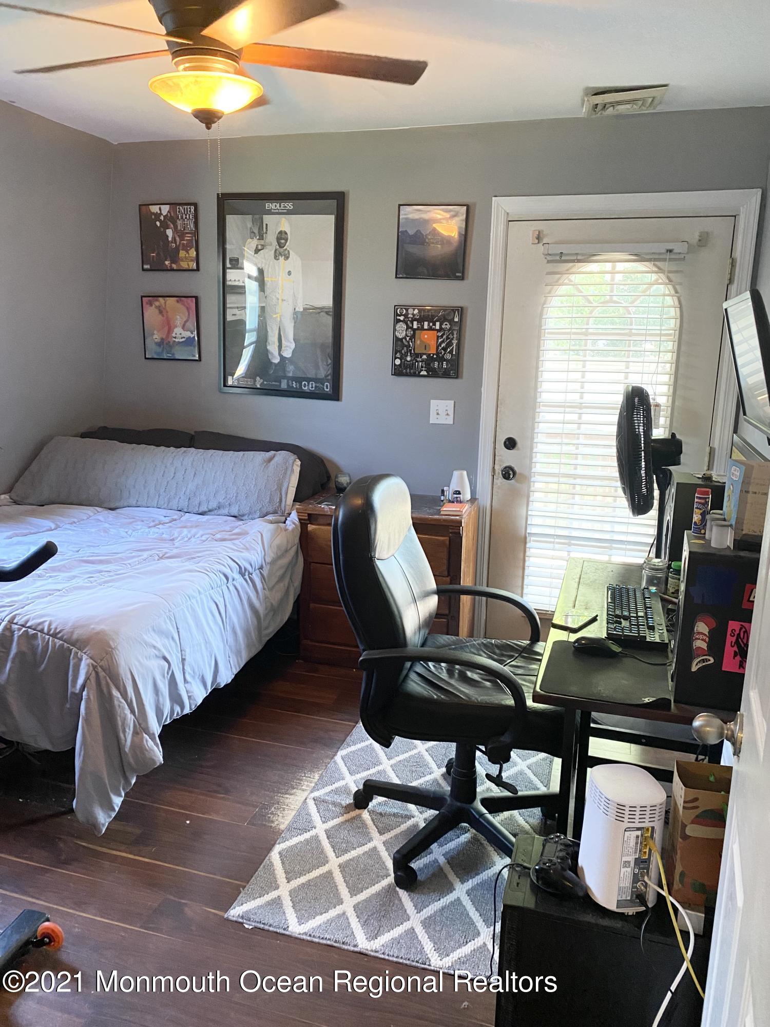 103 George Road Toms River, NJ 08753 - Photo 25 of 34 a bedroom with a bed and wooden floor