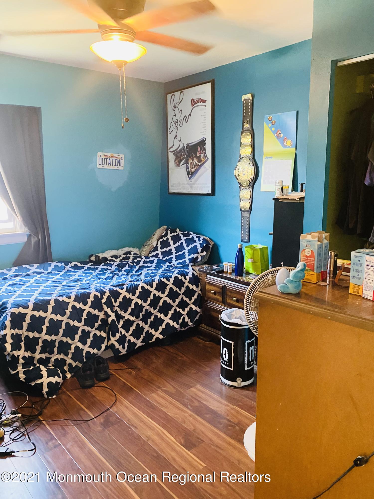 103 George Road Toms River, NJ 08753 - Photo 26 of 34 a bedroom with a bed and flat screen tv