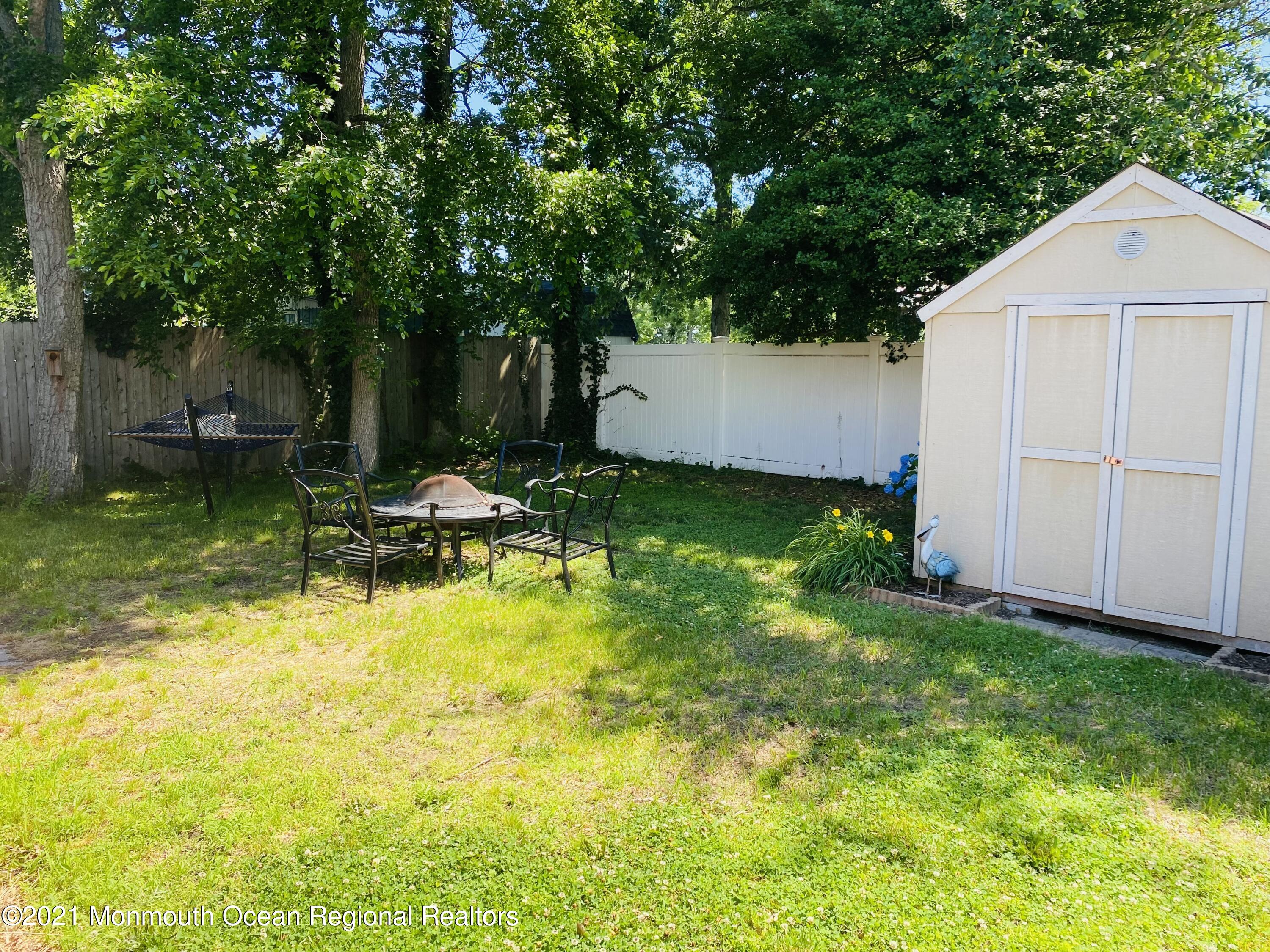 103 George Road Toms River, NJ 08753 - Photo 32 of 34 a view of a backyard with plants and large tree