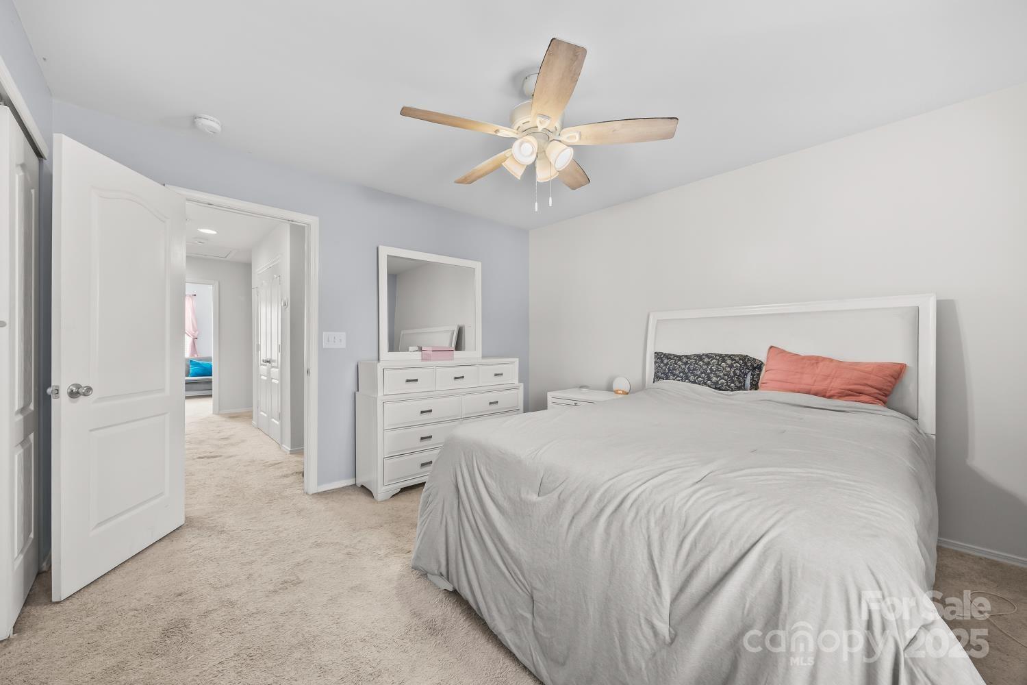 708 Elders Story Road Fort Mill, SC 29708 - Photo 23 of 31 a bedroom with a bed and a chandelier