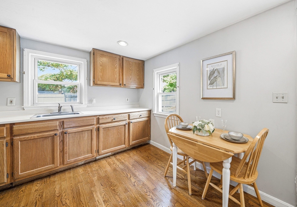 63 Juniper Road Holbrook, MA 02343 - Photo 11 of 35 a kitchen with stainless steel appliances kitchen island granite countertop a sink and cabinets