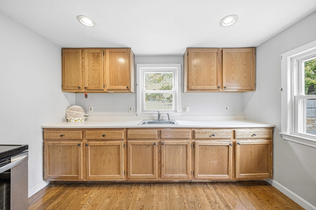 63 Juniper Road Holbrook, MA 02343 - Photo 14 of 35 a kitchen with white cabinets and sink