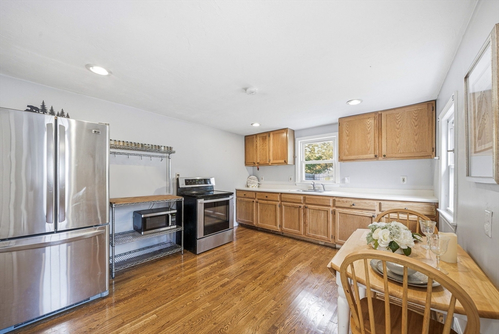 63 Juniper Road Holbrook, MA 02343 - Photo 15 of 35 a kitchen with stainless steel appliances granite countertop a refrigerator sink and stove